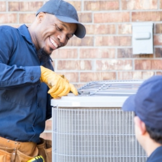 family-and-contractor-reviewing-blueprints